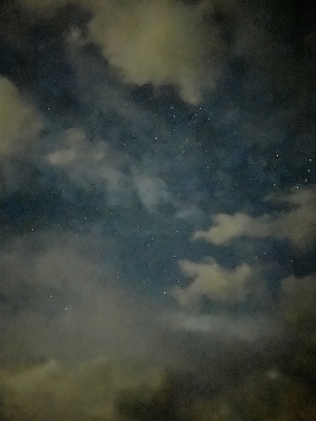 A shot of a starfield and clouds through my iphone camera